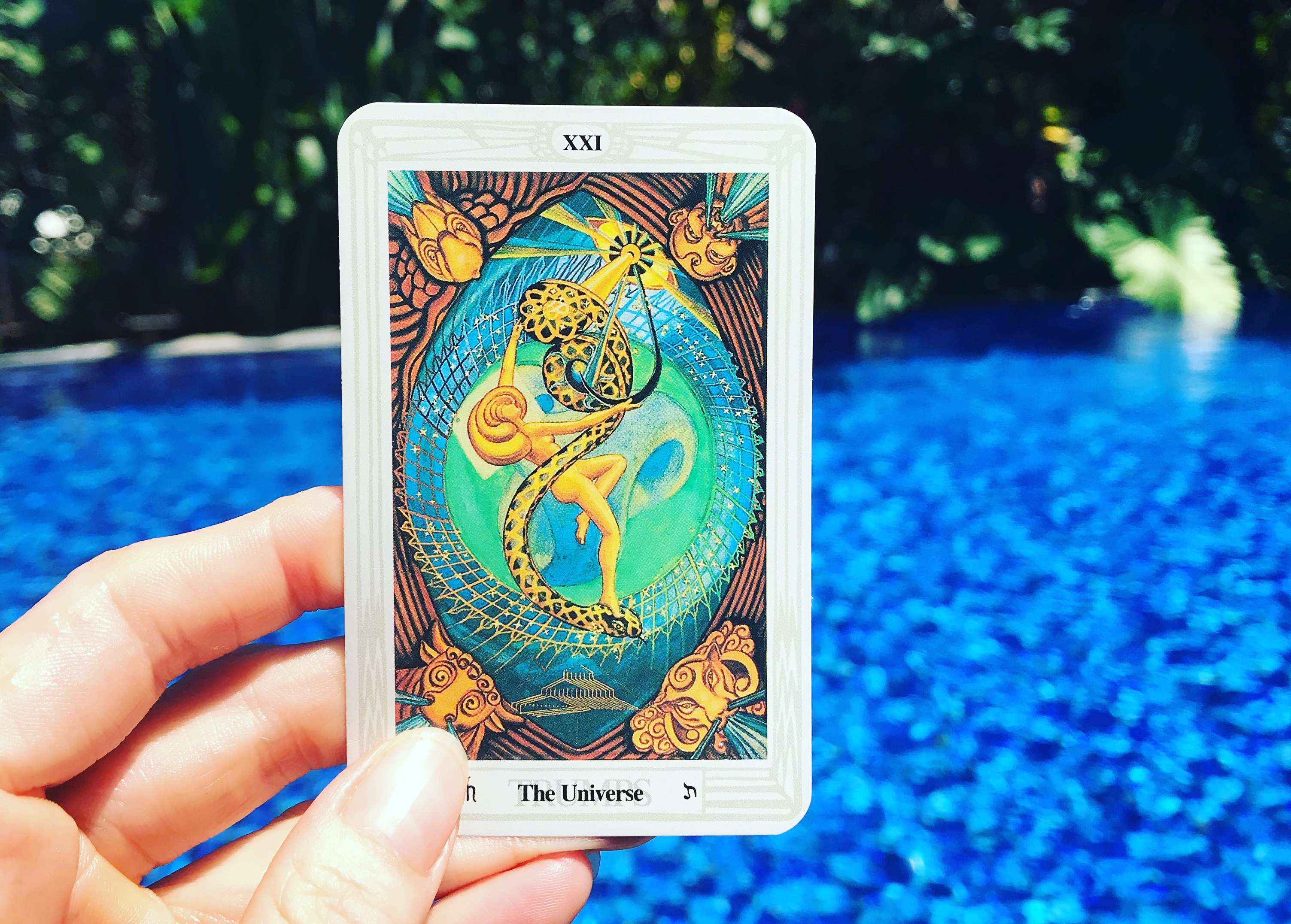 The Universe or world Tarot card, taken in front of the beautiful pool at Sanur, Bali at the Taksu hotel